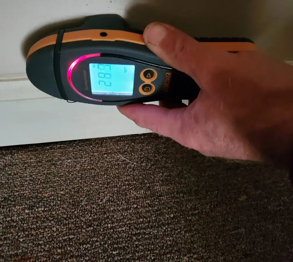 Moisture detection at baseboard during Storm Damage Restoration in Essex Junction